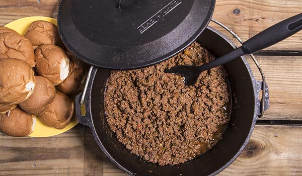 Delicious easy Dutch oven sloppy joes and a plate of slider buns to put them on.