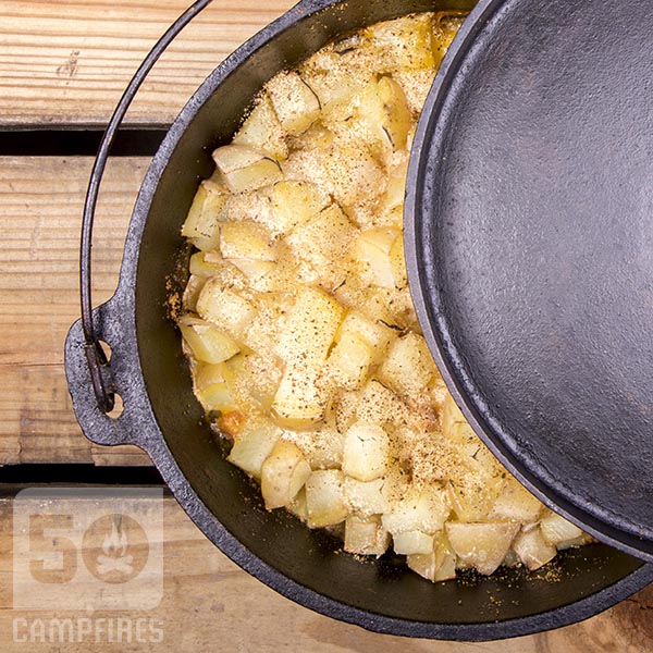 Yukon Gold potatoes layered on top of pork chops give Dutch Oven Pork Chops and Potatoes dish a great golden color with pork chops in creamy gravy on the bottom.