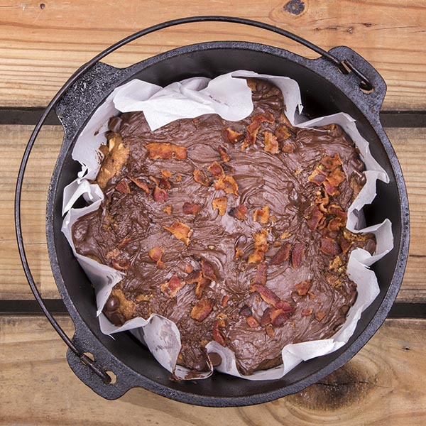 It may sound like a strange flavor combination, but these Dutch oven peanut butter, chocolate, and bacon bars are a smash hit for any camping trip.