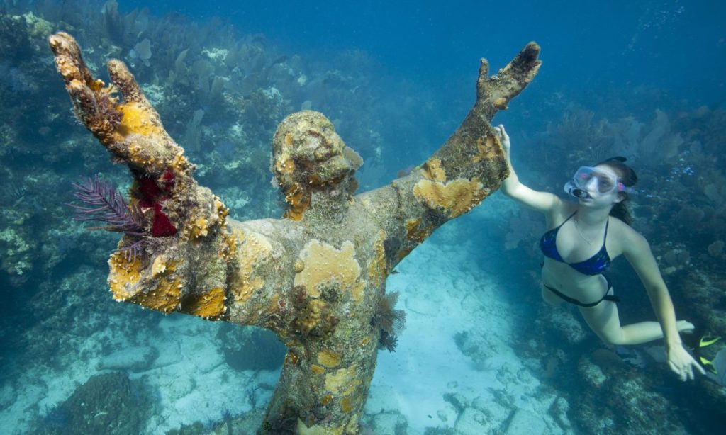 Snorkeler with Bronze Statue of Christ. Snorkeler with Bronze Statue of Christ.