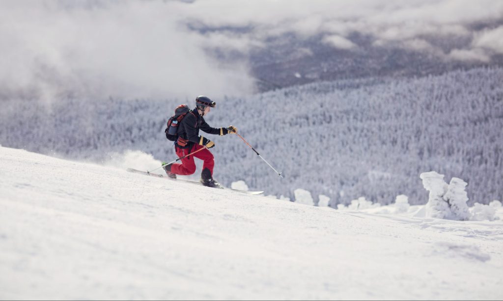 A backcountry skier rides the snowfields on Burnt Mountain, Maine.