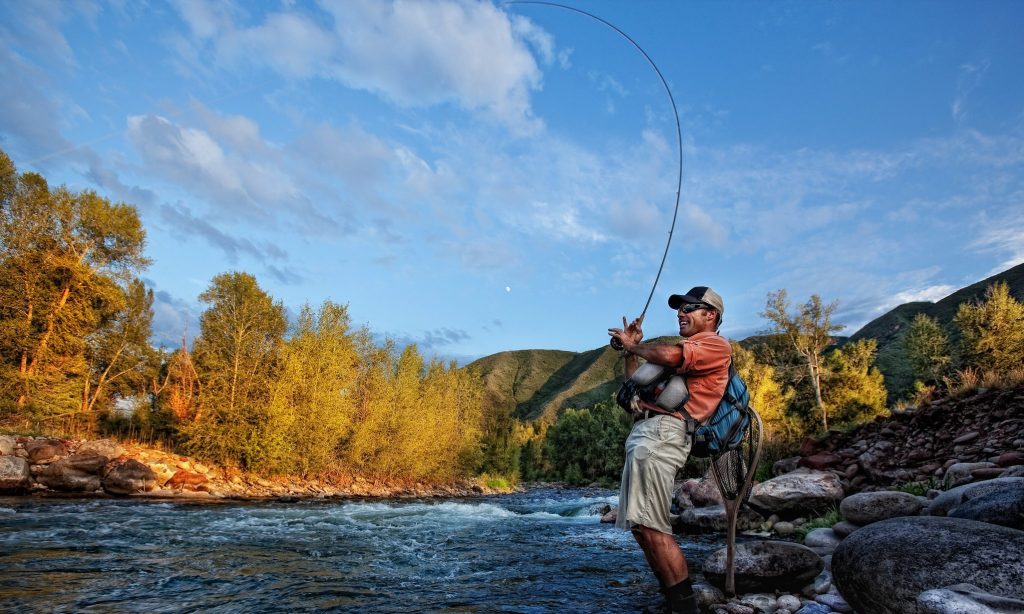 A fly fisherman enjoy a little stream time on the Roaring Fork River near Aspen, CO