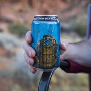Close up of a can of Fathom IPA in Nick's hand.