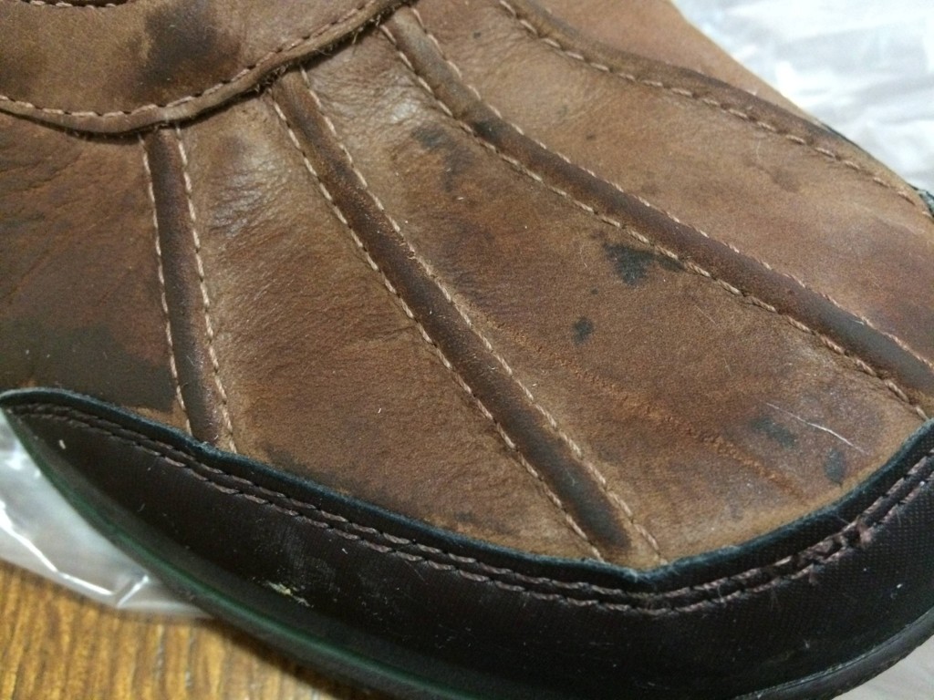 If your boots are dirty, you'll want to clean them before coating the dirt with wax. 