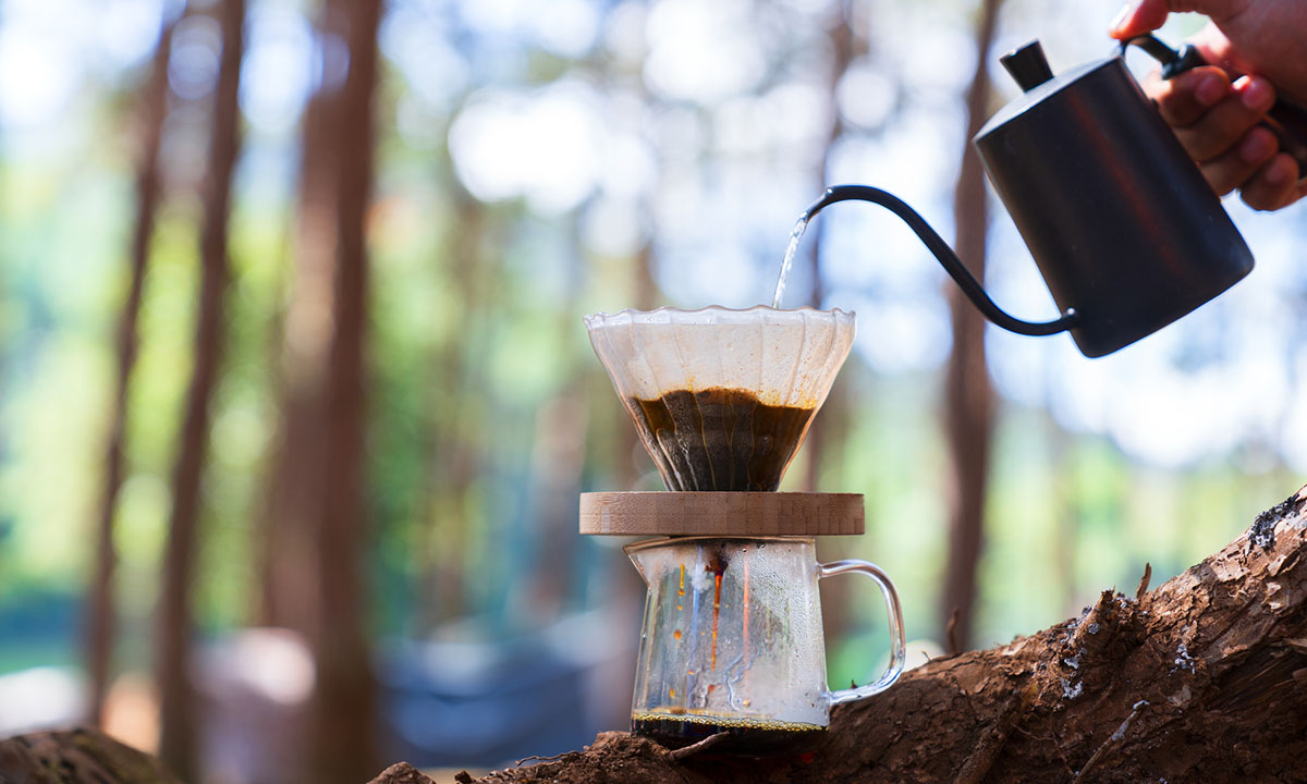 Process of making camping coffee outdoor Stock Photo by bondarillia
