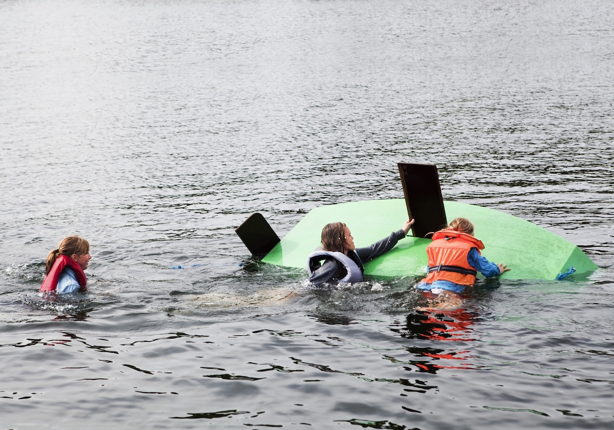 surfers rescue capsized boat