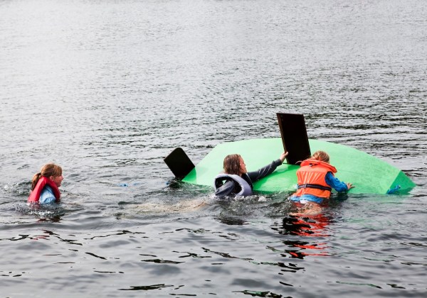 surfers rescue capsized boat